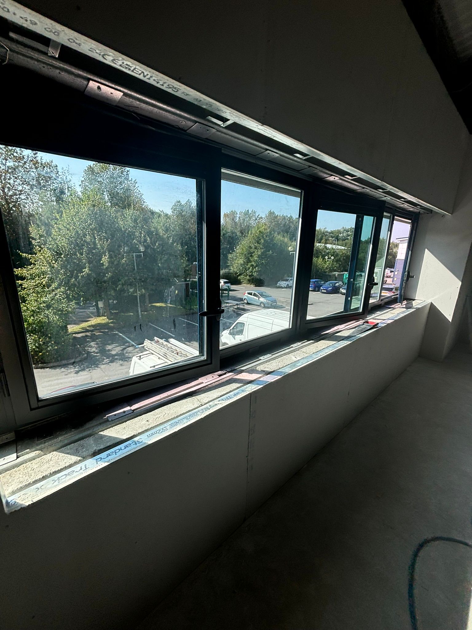 Black aluminium window frames in commercial unit interior